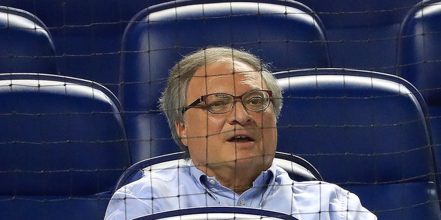 Jeffrey Loria sits in stands