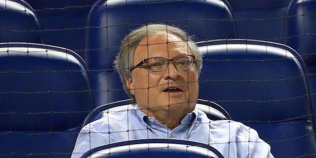 Jeffrey Loria sits in stands