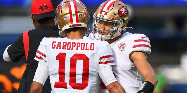 Jimmy Garoppolo and Trey Lance next to each other