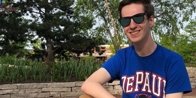 John Castic wears sunglasses and a DePaul Unversity T-shirt