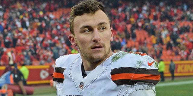 Johnny Manziel looks on field