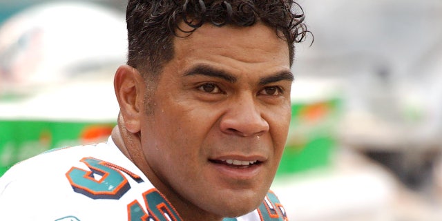 Junior Seau looks on field