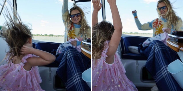 Kate Hudson and her daughter dancing on a boat