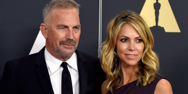 Kevin Costner and Christine Baumgartner at the Academy Awards in 2014