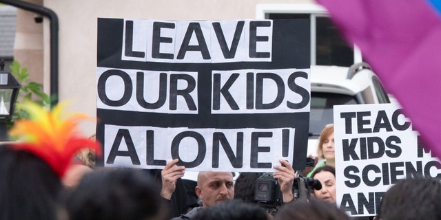 Leave our kids alone sign