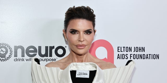 Lisa Rinna poses on the red carpet at the Elton John AIDS Foundation event