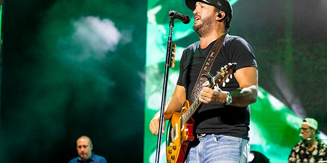 Luke Bryan performing on stage