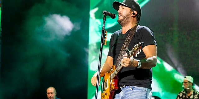 Luke Bryan performing on stage