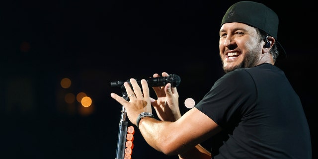 Luke Bryan on stage singing