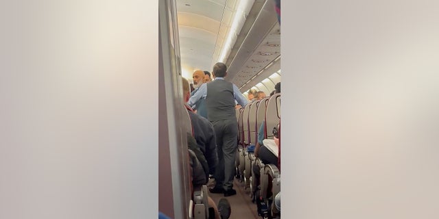 Malaysia Airlines passenger arrested after midair 'emergency incident' forces flight to return to Australia 2 Malaysia Airlines passenger questioned during 'emergency incident'