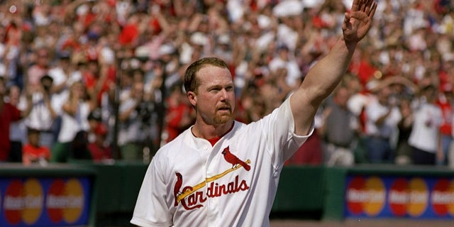 Mark McGwire waves to the crowd