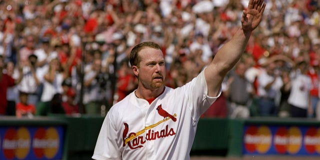 Mark McGwire waves to the crowd
