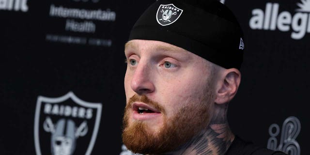 Maxx Crosby speaks during a press conference