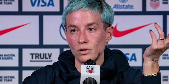 Megan Rapinoe talks to reporters