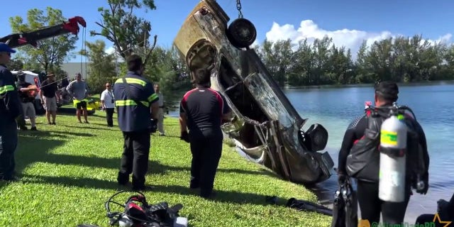 submerged car being pulled out of lake