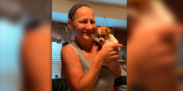 Missing New Jersey grandma Norma Yates poses with a puppy