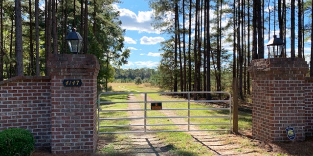 The fence in front of the Murdaugh hunting lodge