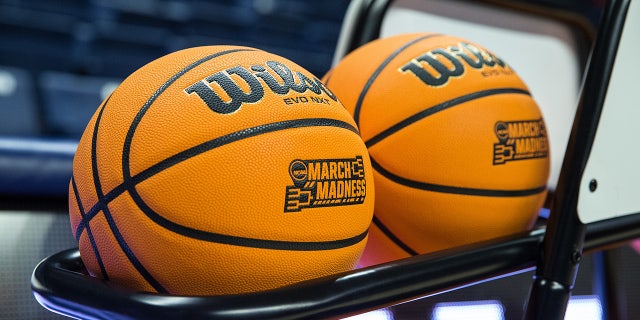 NCAA basketballs on rack