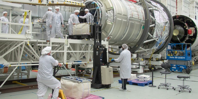 People work on Northrop Grumman’s 19th commercial resupply services mission