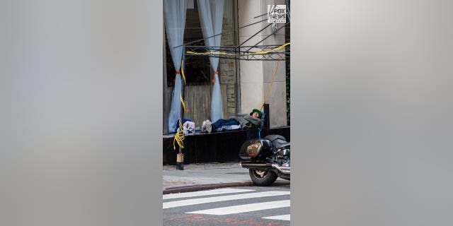 Migrants resting outside Roosevelt Hotel in Manhattan
