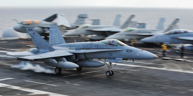 FA-18 Hornet lands on USS Ronald Reagan flight deck