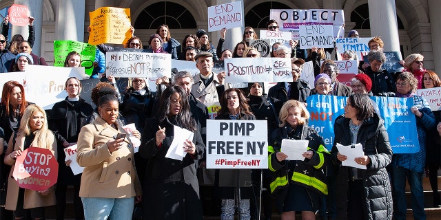 Woman gathered at New York City Hall.