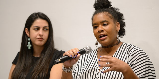 Melanie Thompson speaking at a conference.