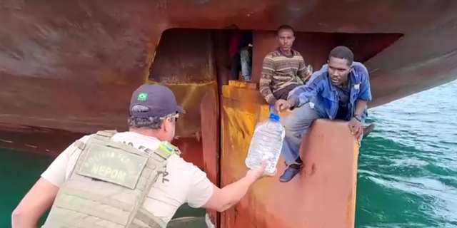Water offered to Nigerian stowaways on cargo ship's rudder