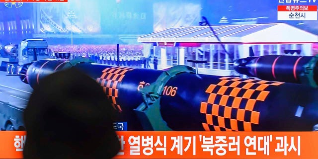 South Koreans watch North Korean military parade on TV
