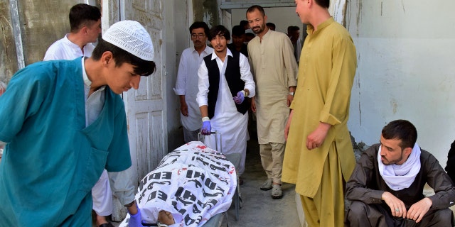 Hospital staff transfers body
