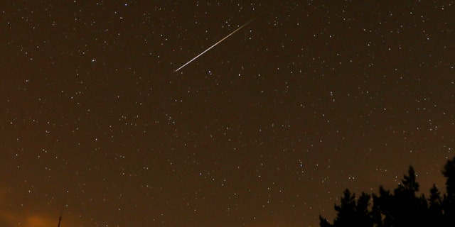 A streak appears in the sky during the annual Perseid meteor shower