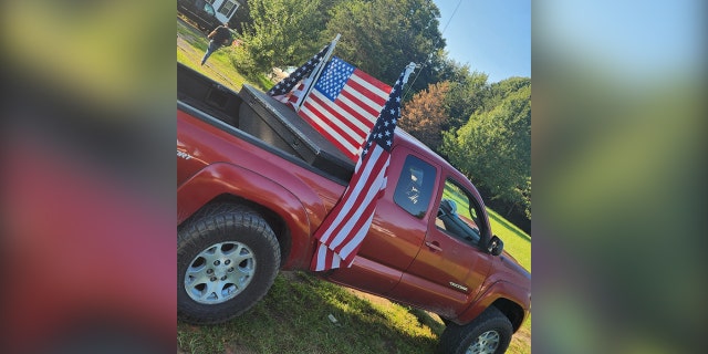 photo of flags on teenager's pickup