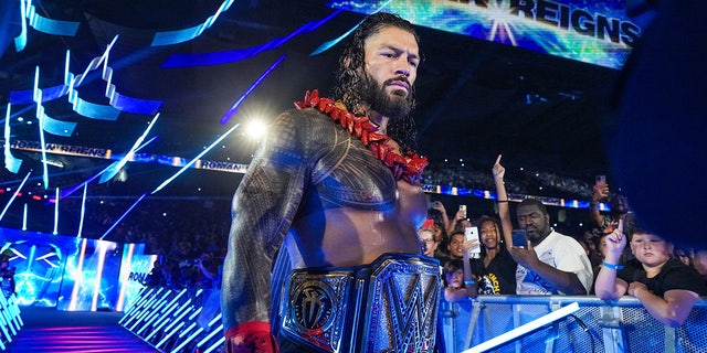 Roman Reigns walks to the ring