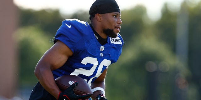 Saquon Barkley runs