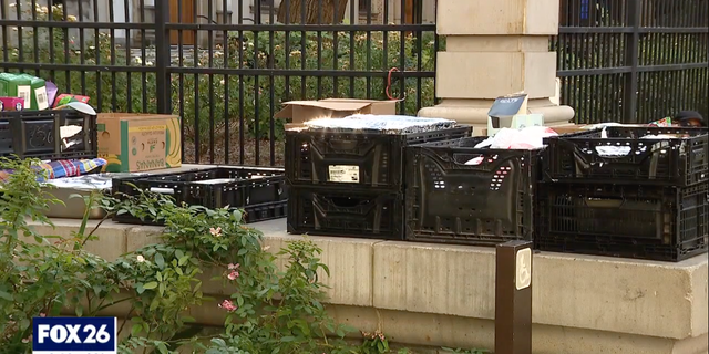Nonperishable food donations can be seen outside the Houston Public Library