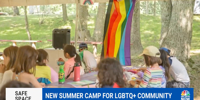 An LGBT flag at a summer camp