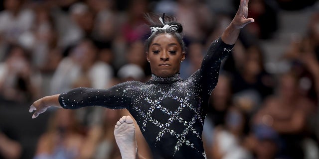 Simone Biles performs on balance beam