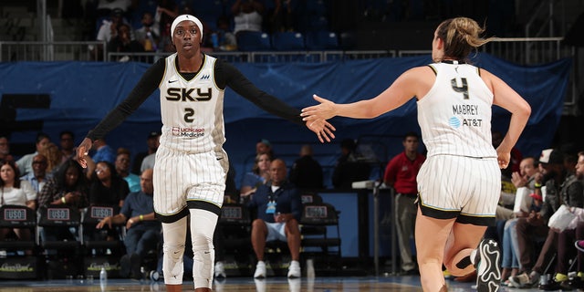 Kahleah Copper high fives during a game