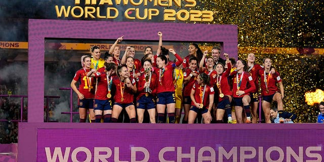 Players lifts the trophy after winning the FIFA Womens World Cup