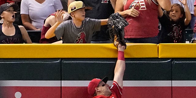 Young fan takes the ball