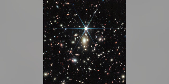 A James Webb Space Telescope image of a massive galaxy cluster called WHL0137-08