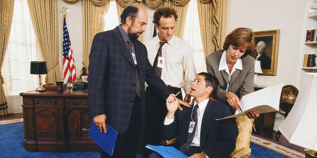Richard Schiff as Toby Ziegler, Bradley Whitford as Josh Lyman, Rob Lowe as Sam Seaborn and Allison Janney as Claudia Jean 'C.J.' Cregg in "The West Wing."