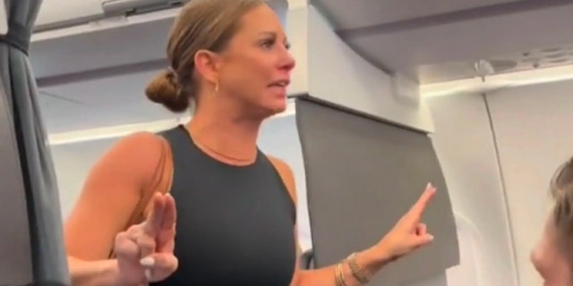Tiffany Gomas gestures during airplane meltdown