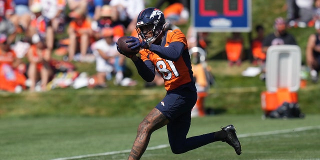 Wide receiver Tim Patrick catches a pass