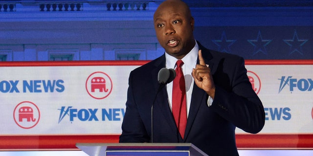 Tim Scott speaks at podium