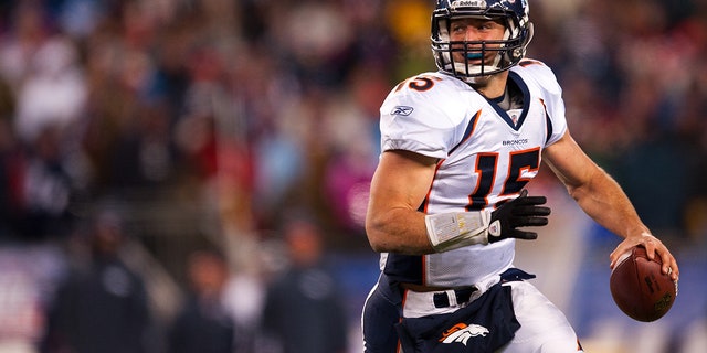 Tim Tebow looks to pass