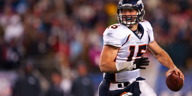 Tim Tebow looks to pass