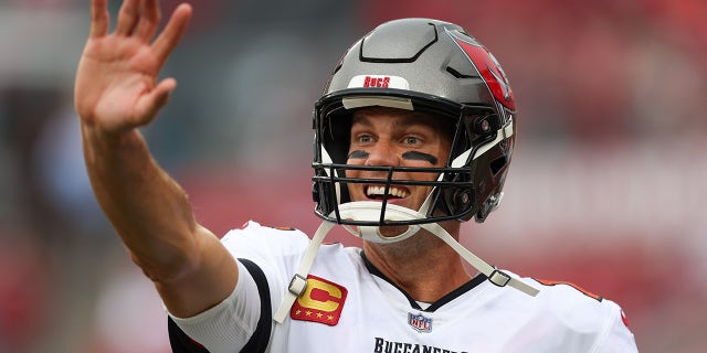 Tom Brady waves