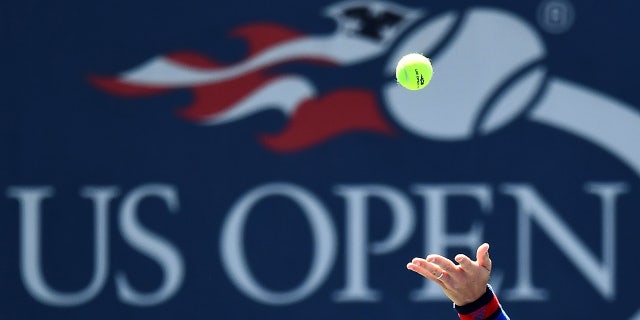 Player serves ball at US Open