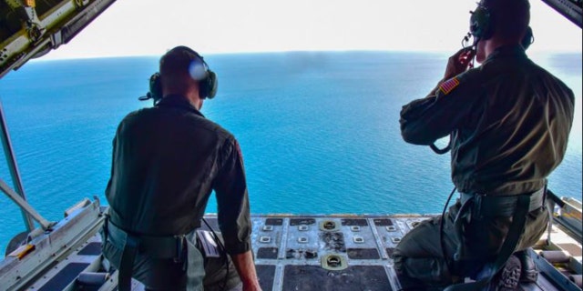Coast Guard aircraft searching waters
